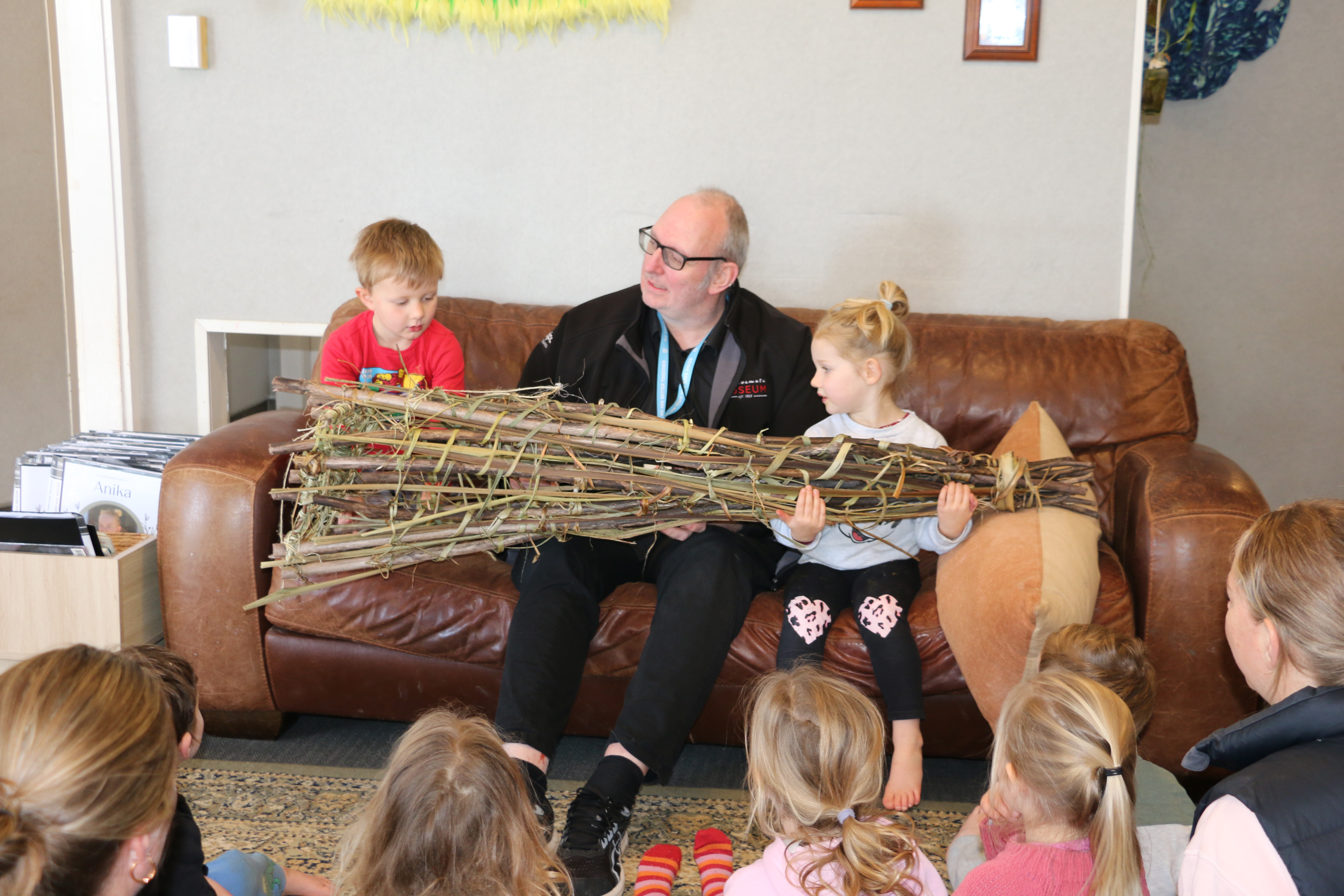 Education facilitator Kerrin Carr chats to children at Te Awamutu’s Flourish Early Learning about the hīnaki (eel trap) they made. 