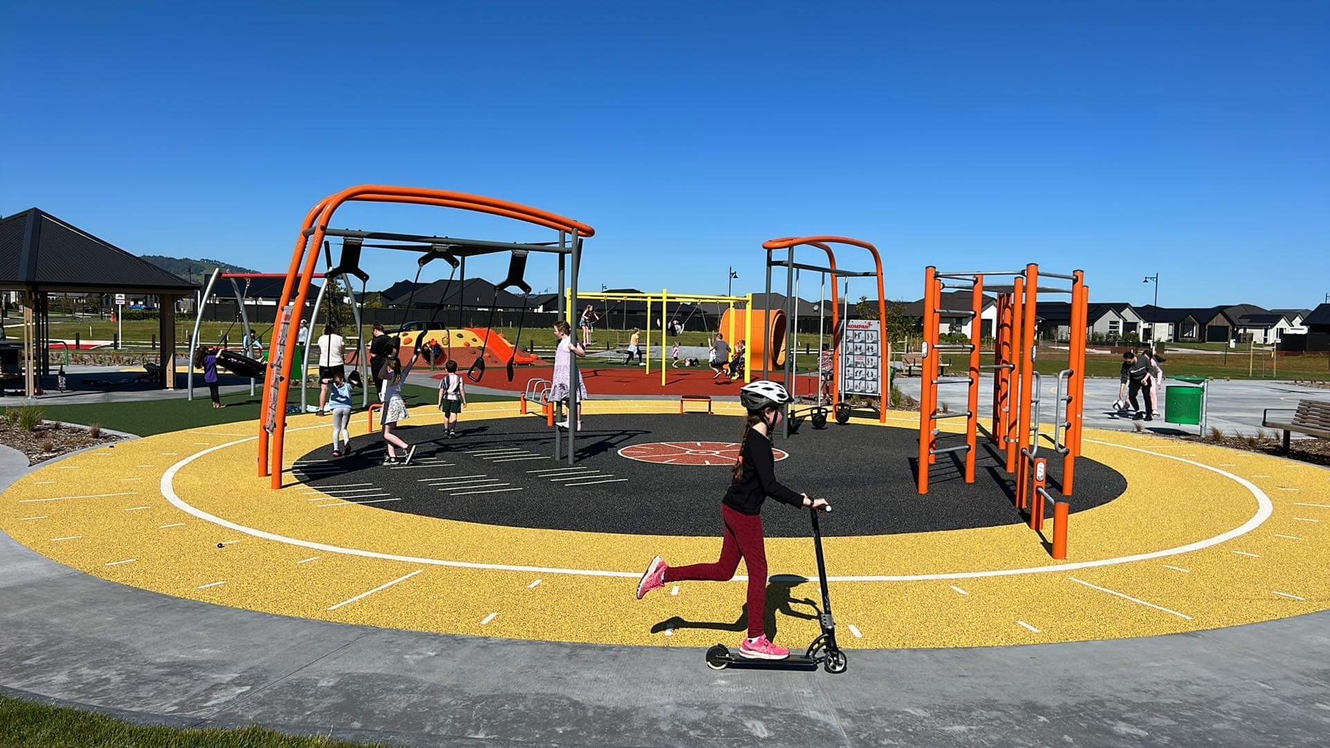 Local children enjoying the new playground on Terry Came Drive.