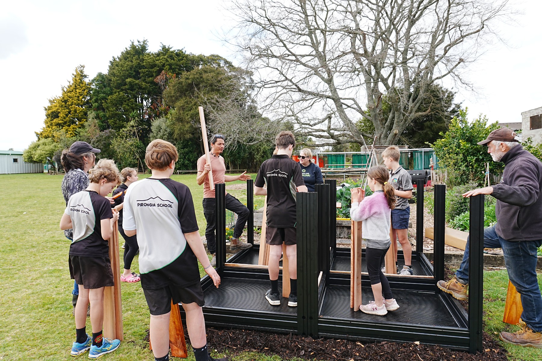 Pirongia School EnviroSchool leaders working together to set up their compost hub.