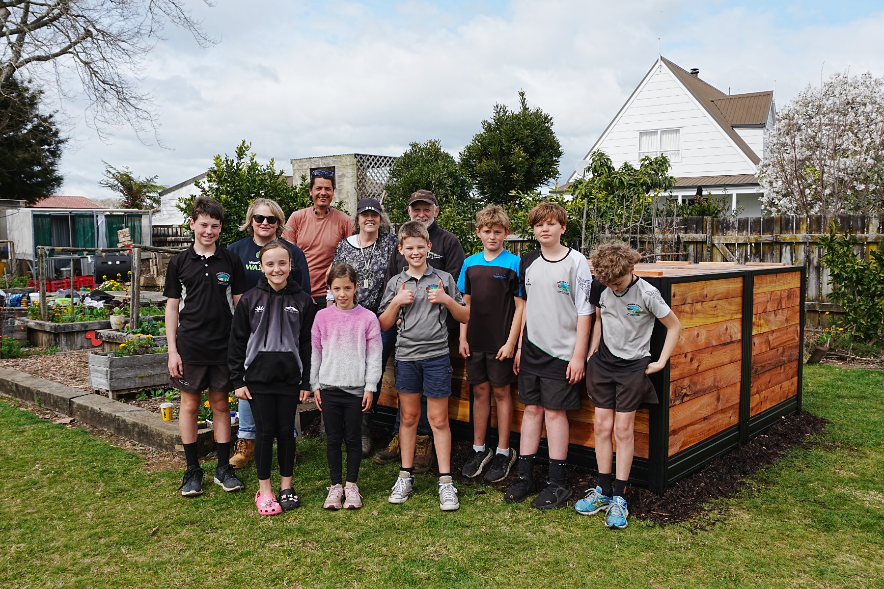 The CarbonCycle Company and Waipā District Council representatives supporting Pirongia School to build and learn about their new compost hub.