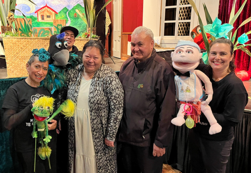 Three of the puppetry performers with whānau at the Tales from the Pā Harakeke show in Te Awamutu.